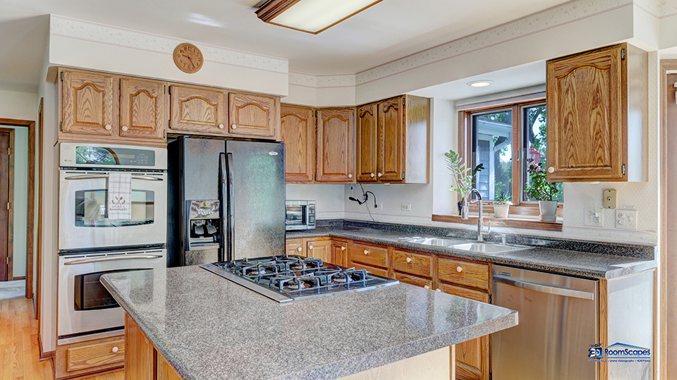 2276 High Point Drive Lindenhurst, IL 60046 - Photo 8 of 15 a kitchen with stainless steel appliances granite countertop a sink stove and refrigerator