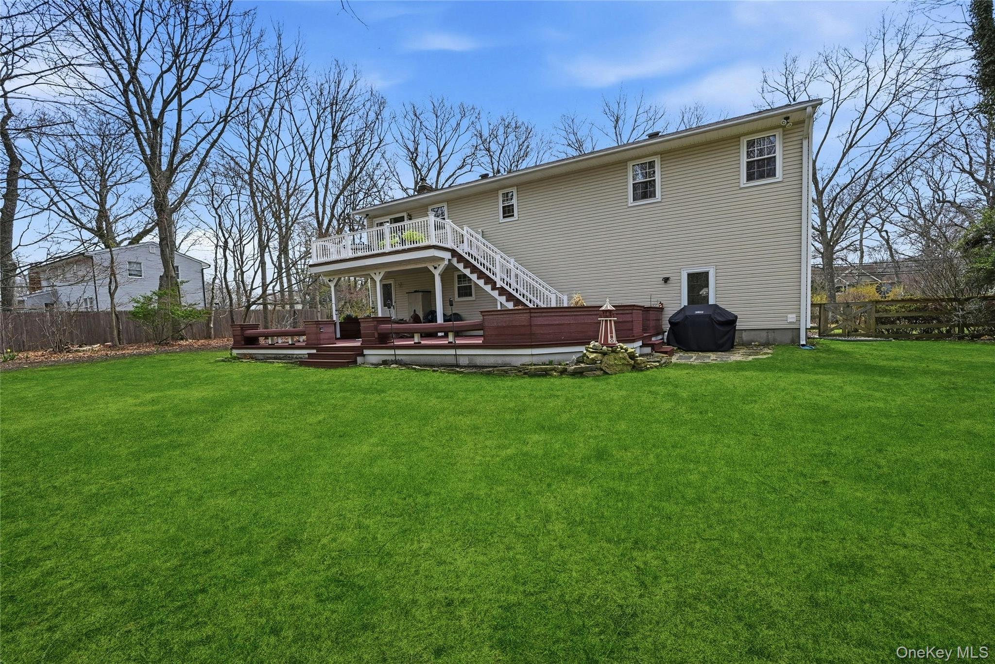 41 North Country Road Shoreham, NY 11786 - Photo 24 of 31 Back of house with decks on each level.