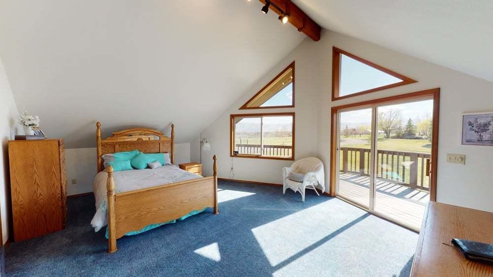 301 Red Tail Road Yakima, WA 98908 - Photo 19 of 52 a bedroom with a bed and large window