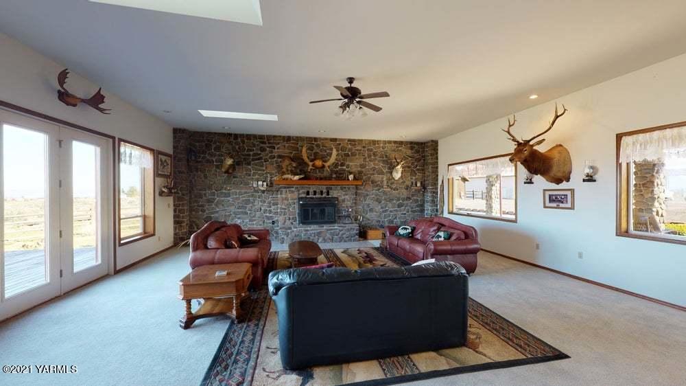 301 Red Tail Road Yakima, WA 98908 - Photo 10 of 52 a living room with furniture fireplace and a large window