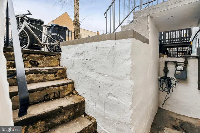 a room with a window and gym equipment