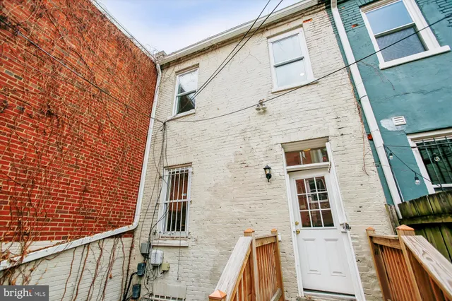 a picture of a bench in front of a microwave