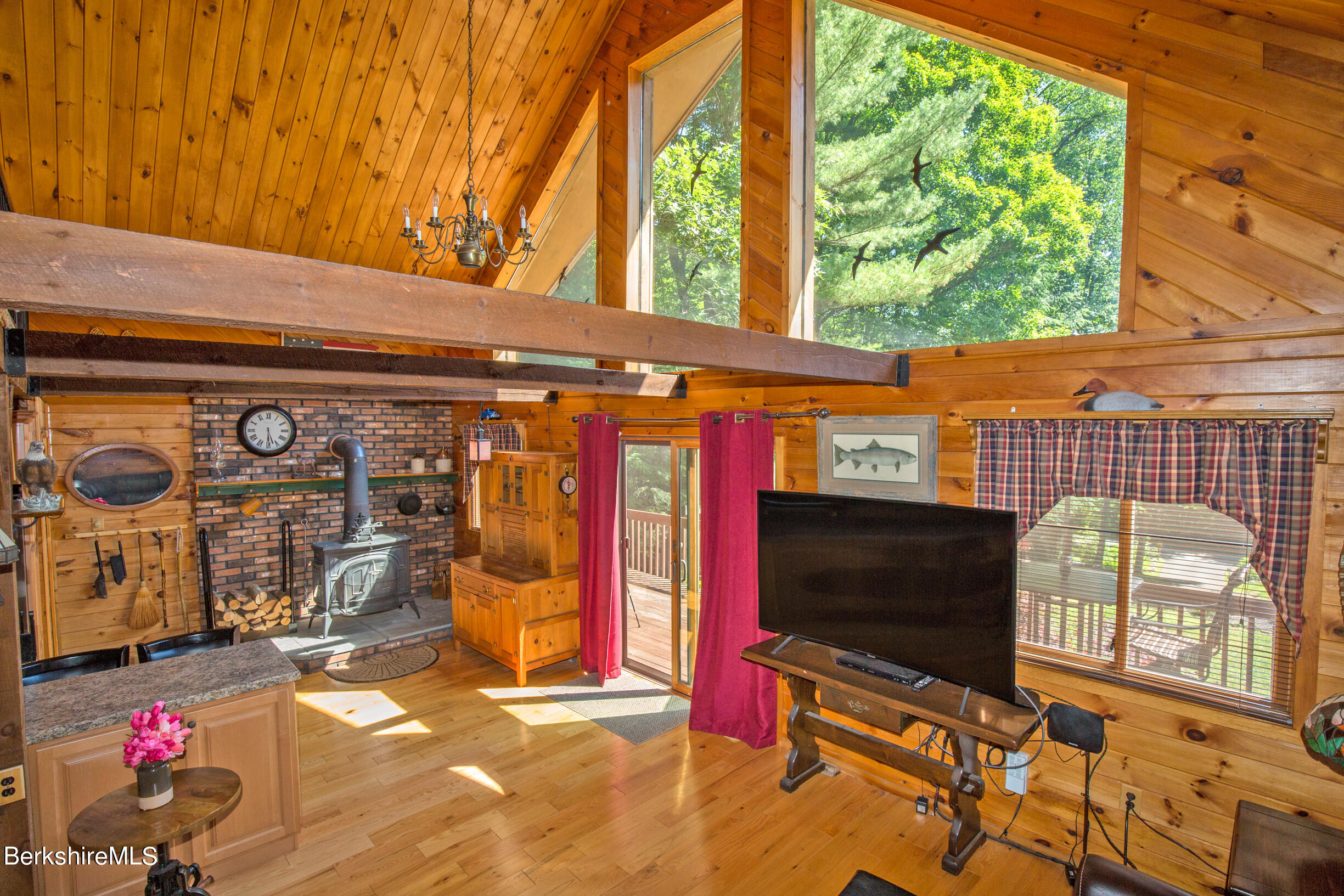 257 West Center Road Otis, MA 01253 - Photo 20 of 44 a living room with fireplace furniture and a flat screen tv