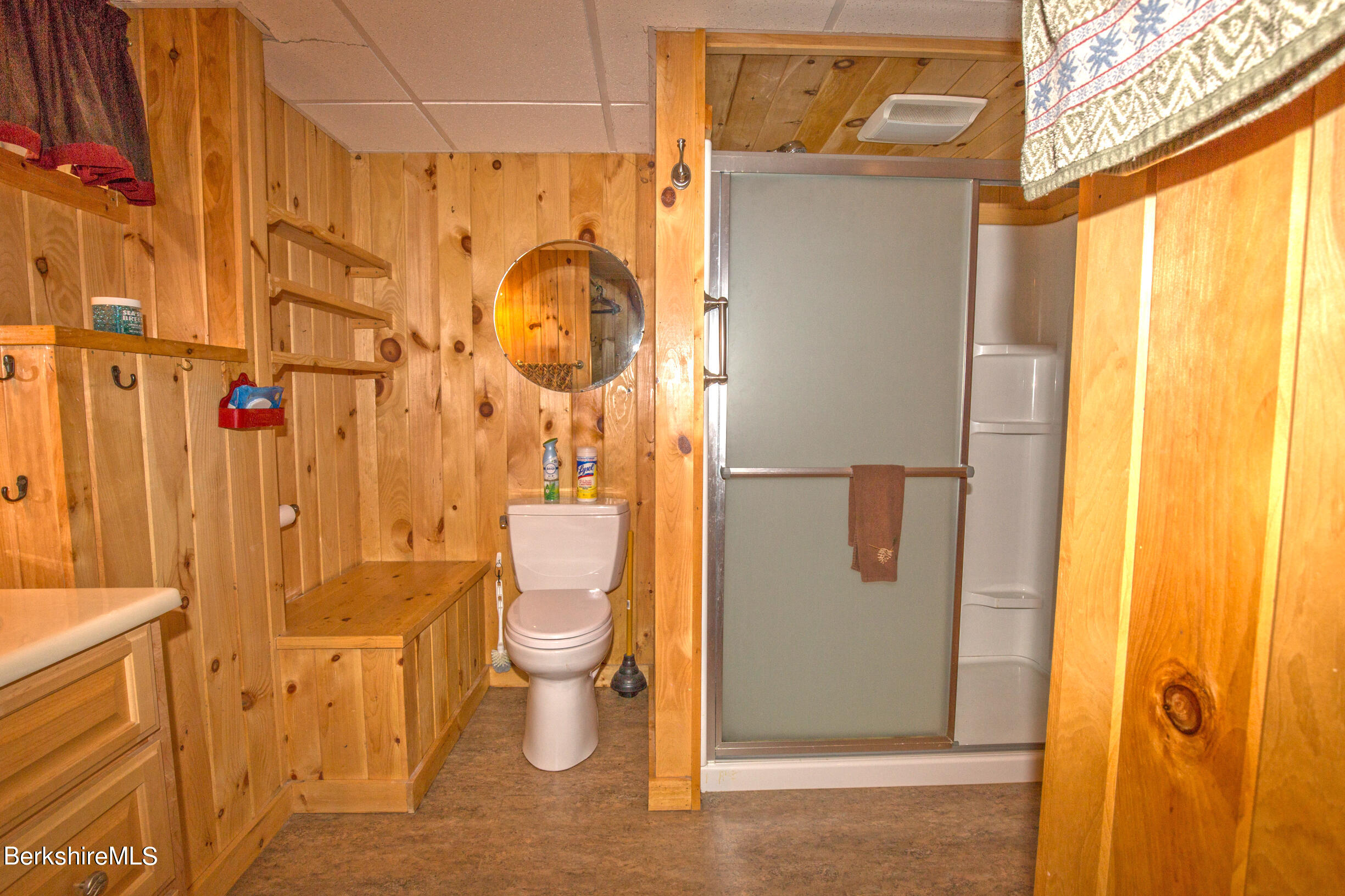 257 West Center Road Otis, MA 01253 - Photo 32 of 44 a bathroom with a granite countertop shower and a toilet