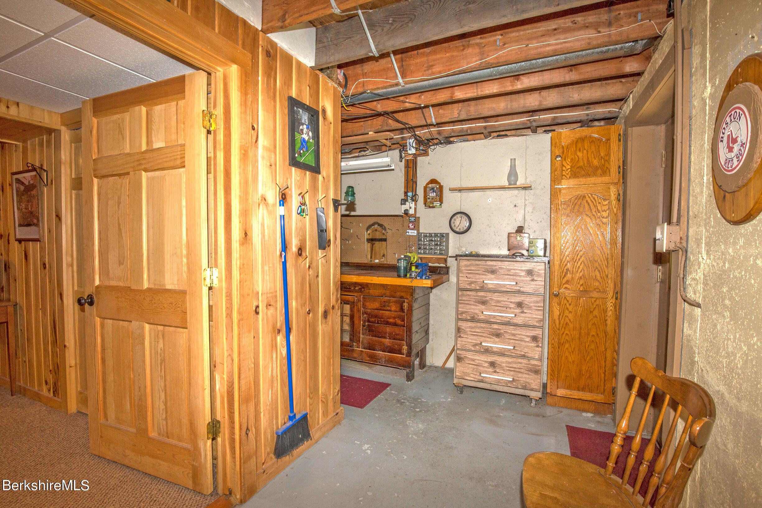 257 West Center Road Otis, MA 01253 - Photo 33 of 44 a view of walk in closet with furniture and a window