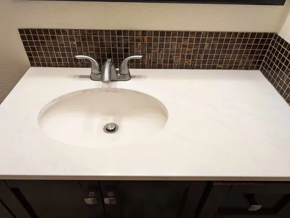 a bathroom with a toilet and a mirror