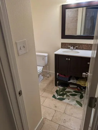 a view of a livingroom with furniture and an entryway