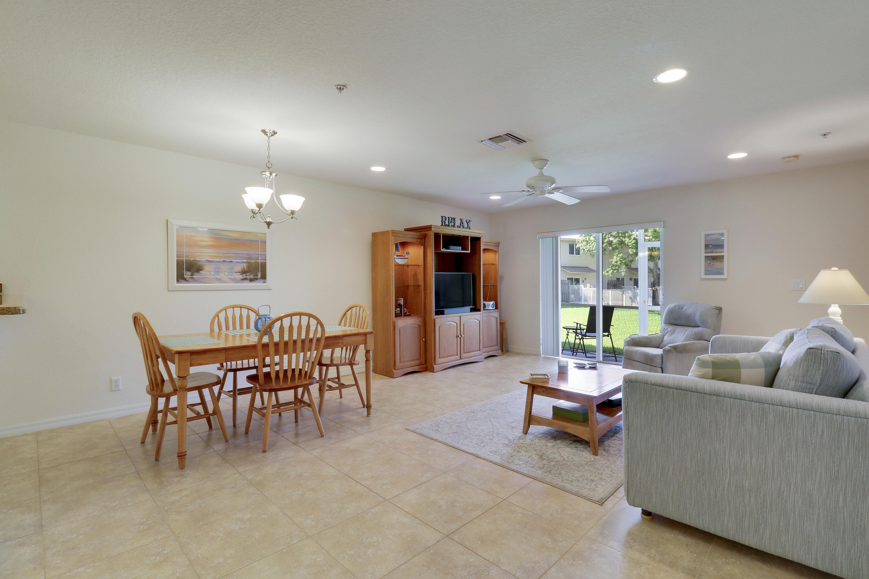 5410 Southeast Mitchell Lane Stuart, FL 34997 - Photo 13 of 24 a living room with furniture and a large window