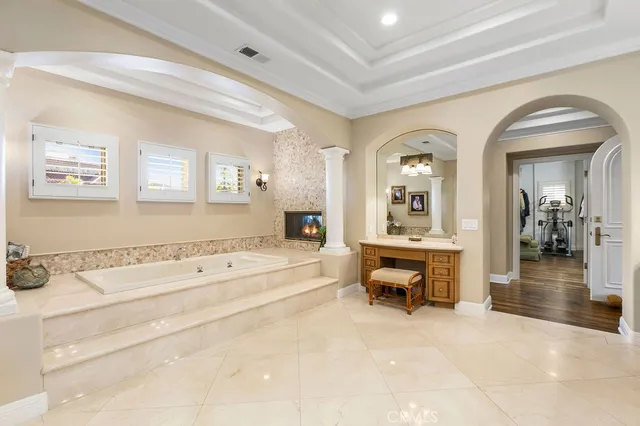 a spacious bathroom with a double vanity sink and a mirror