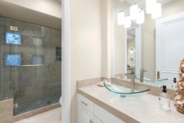 a bedroom with furniture and a flat screen tv