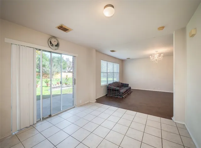 a view of an empty room and window