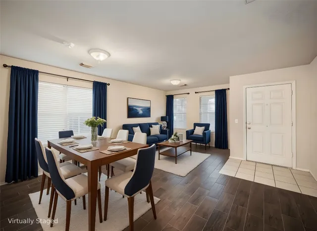 a view of a dining room with furniture window and wooden floor