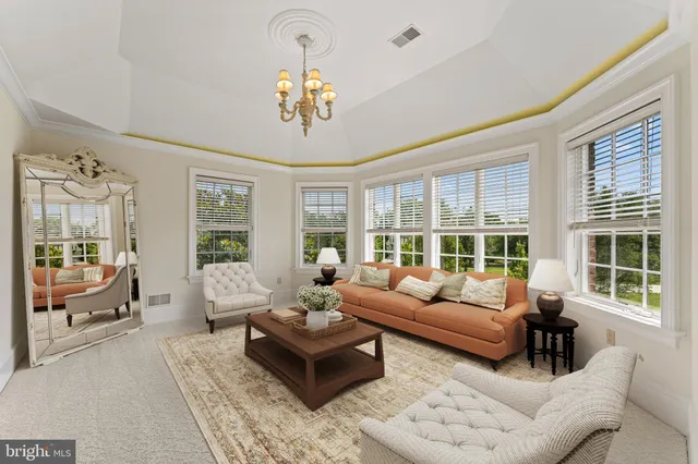 a spacious bathroom with a toilet sink and mirror