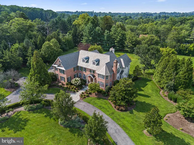 an aerial view of a house with a garden