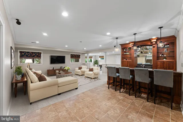 an aerial view of residential house with outdoor space and trees all around