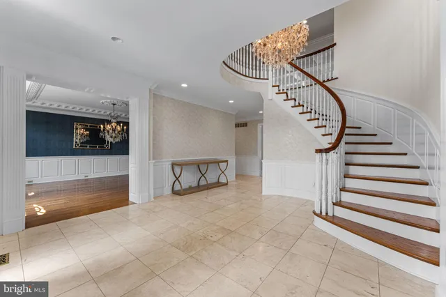 a living room with furniture large window and fireplace
