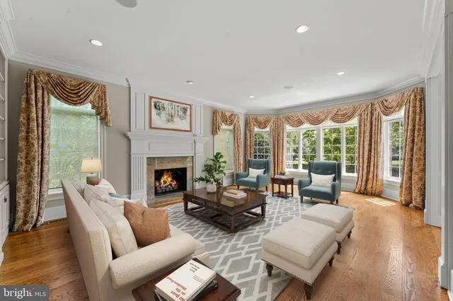 a view of an empty room with a window and fireplace