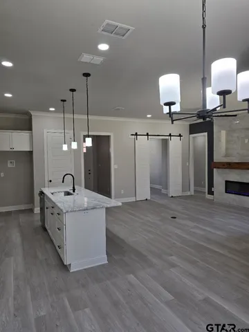 a kitchen with sink and window