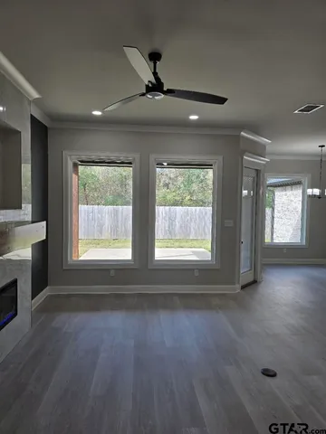 an empty room with a empty space and a window