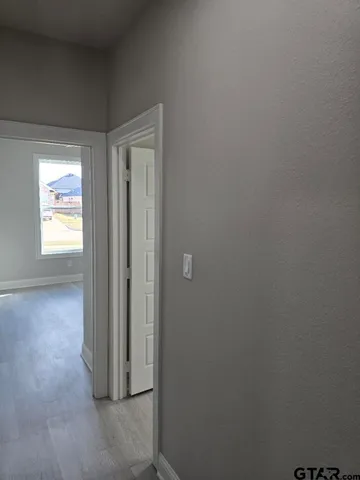 en empty room with wooden floor