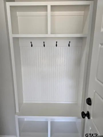 a view of closet area with empty racks
