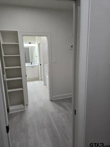 a view of an empty walk in closet