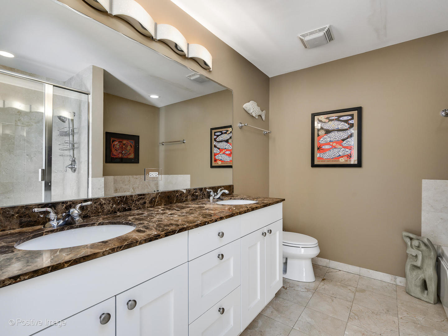 1909 West Diversey Parkway, Unit 501 Chicago, IL 60614 - Photo 11 of 21 a bathroom with a granite countertop sink and a mirror