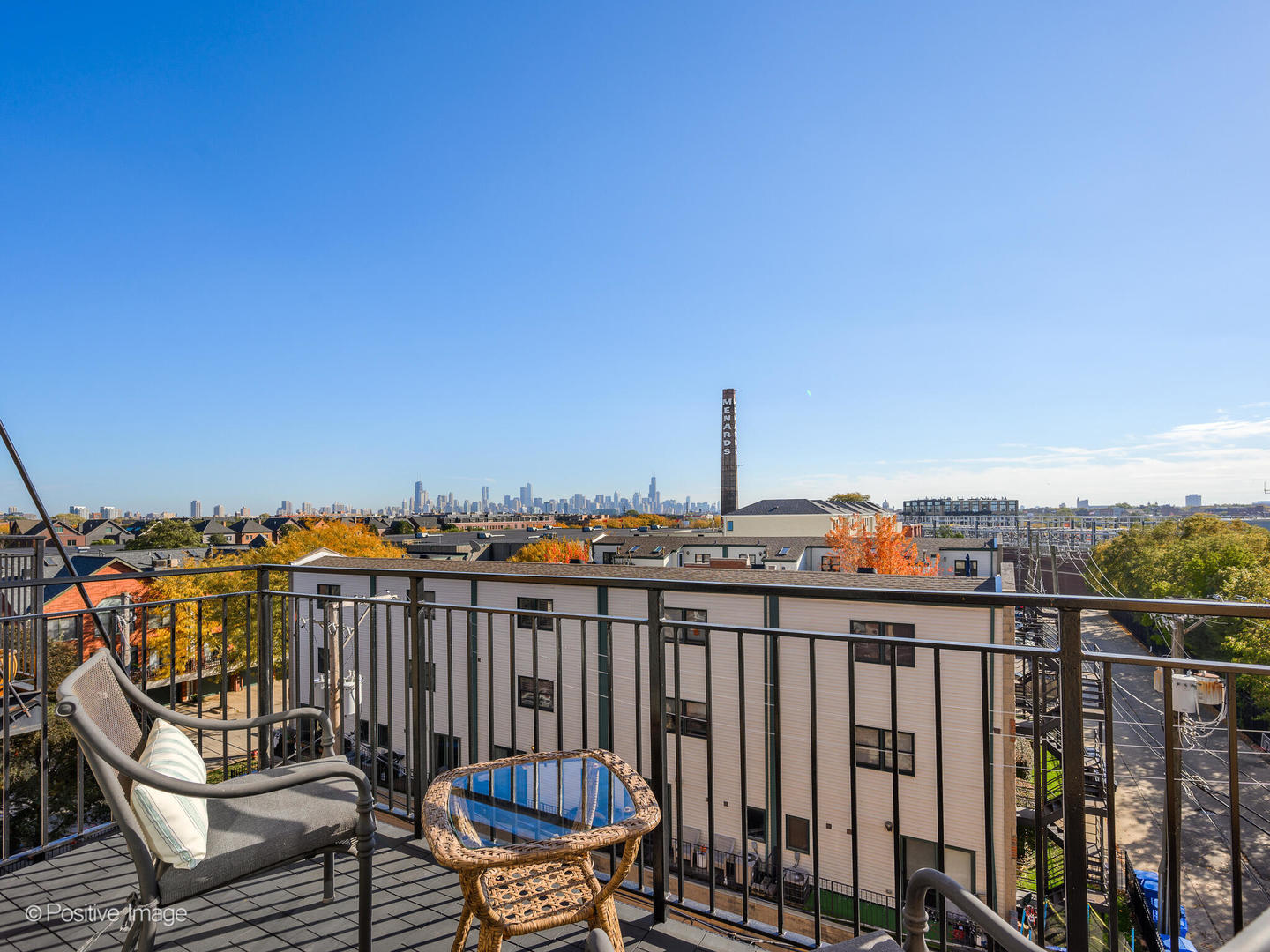 1909 West Diversey Parkway, Unit 501 Chicago, IL 60614 - Photo 13 of 21 a view of a balcony with wooden chairs with wooden floor