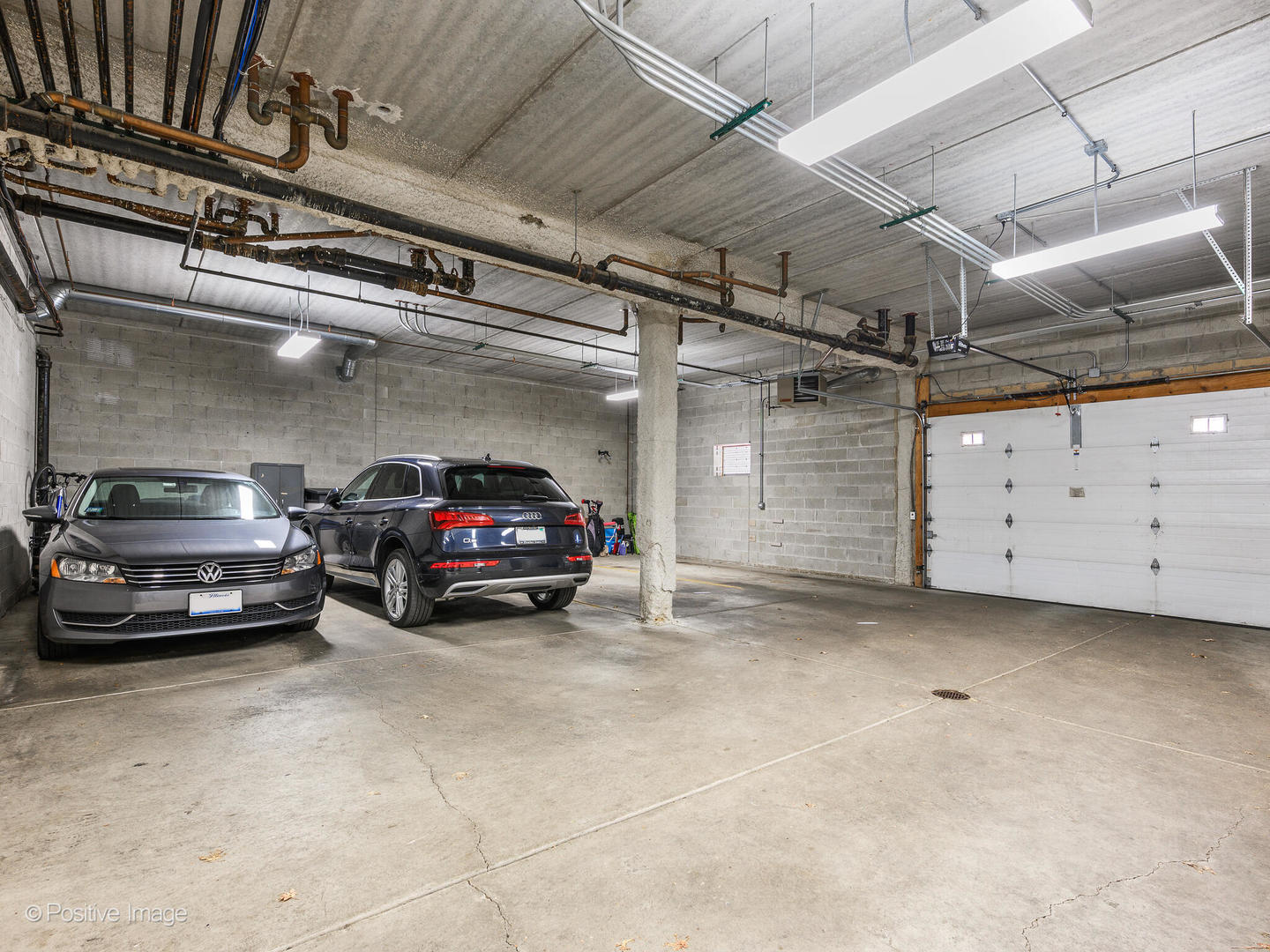 1909 West Diversey Parkway, Unit 501 Chicago, IL 60614 - Photo 19 of 21 a view of garage with cars