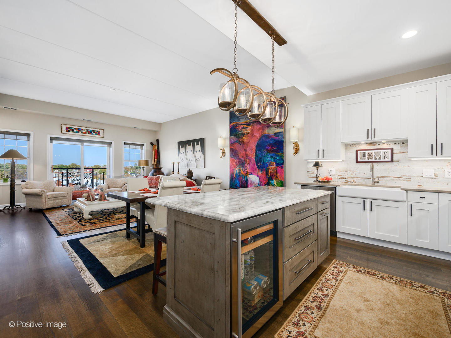 1909 West Diversey Parkway, Unit 501 Chicago, IL 60614 - Photo 2 of 21 a view of a kitchen with kitchen island granite countertop a stove and a sink