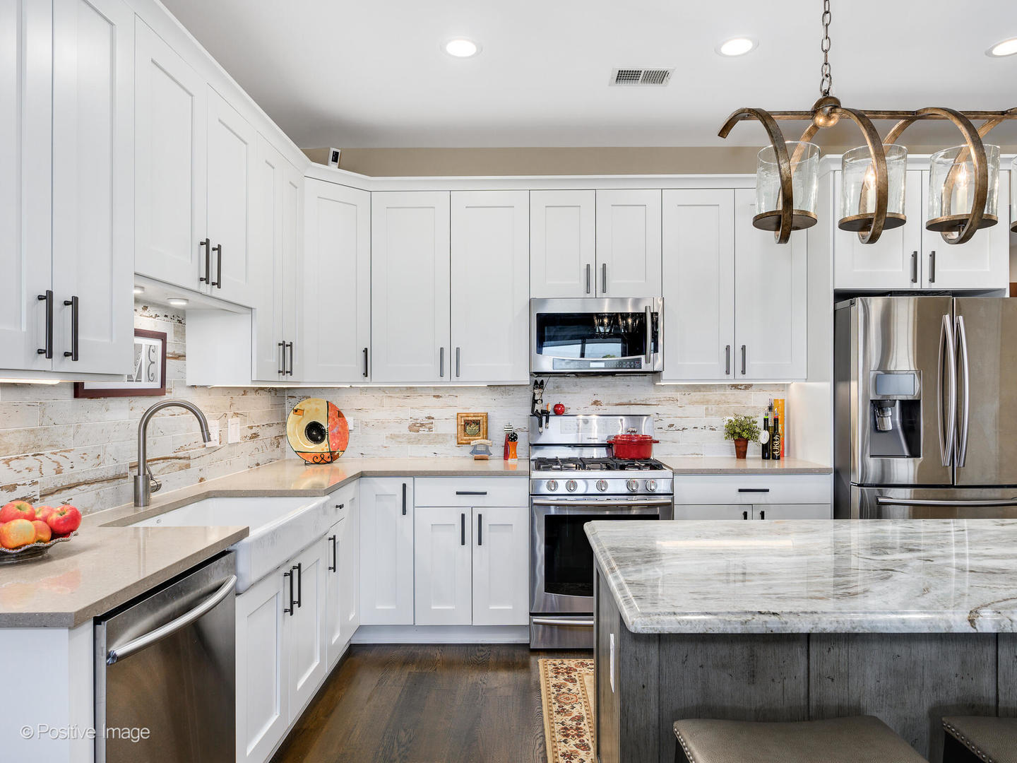 1909 West Diversey Parkway, Unit 501 Chicago, IL 60614 - Photo 9 of 21 a kitchen with a sink a stove and cabinets