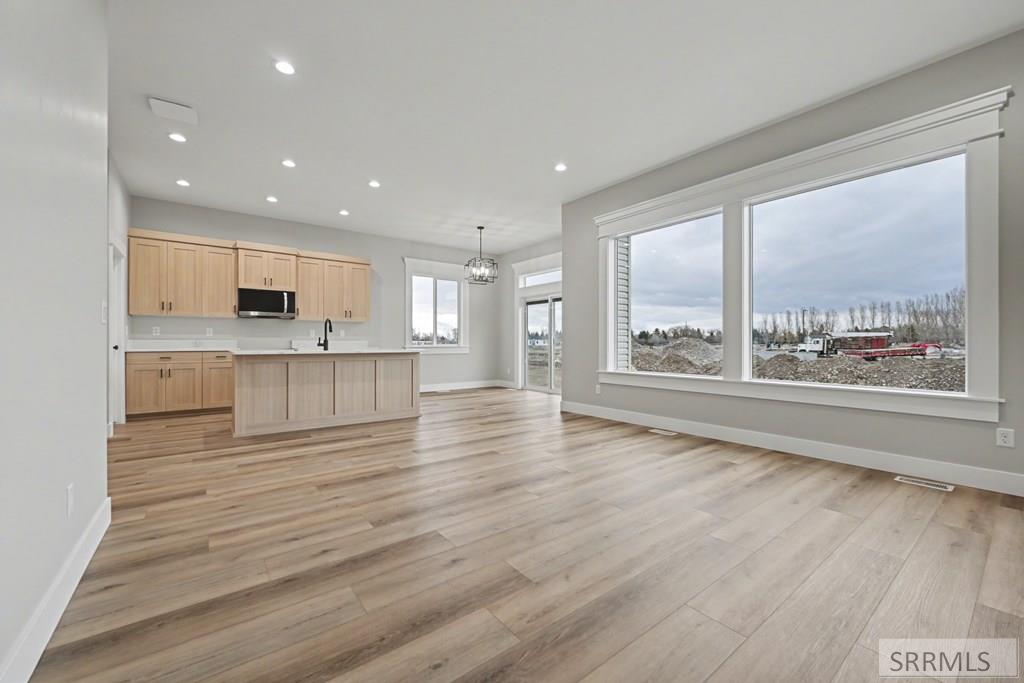 572 Fieldstone Drive Rigby, ID 83442 - Photo 2 of 17 Great Room to Kitchen/Dining Area