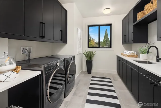 a kitchen with a sink a stove and cabinets
