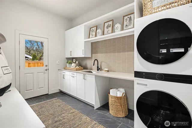 a kitchen with a washer and dryer