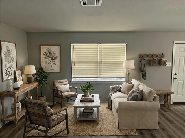 a living room with furniture and a window