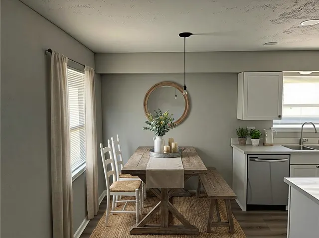 a dining room with furniture and window