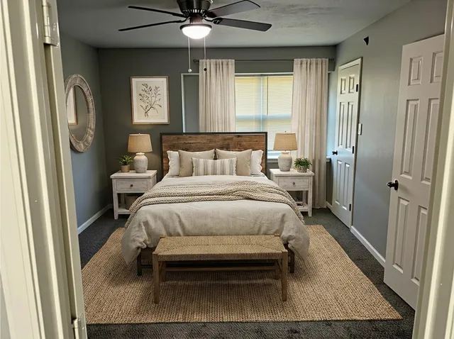 a bedroom with a bed and window