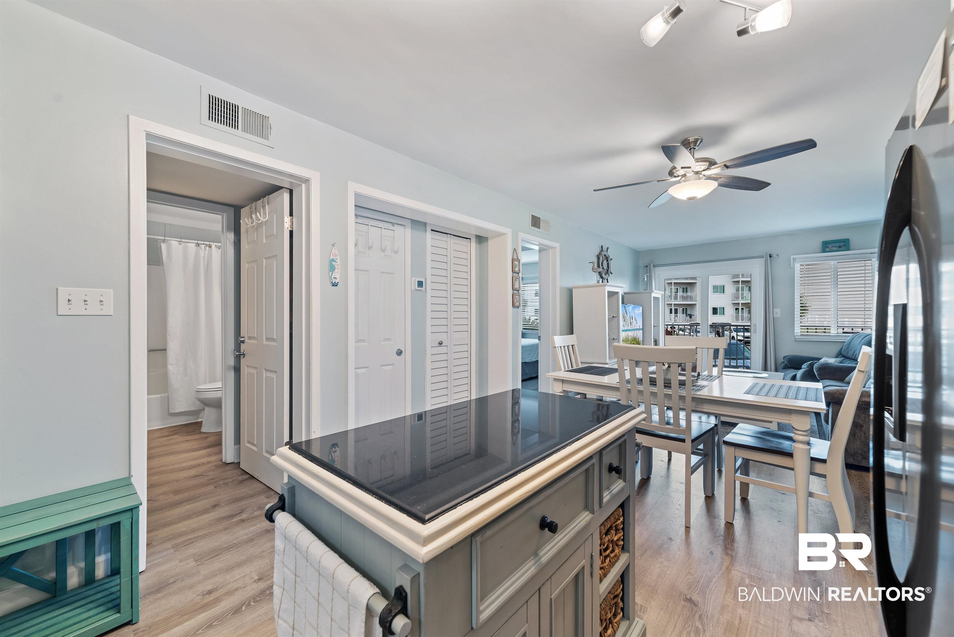 400 Plantation Road, Unit 2123 Gulf Shores, AL 36542 - Photo 7 of 44 Kitchen with gray cabinets, light hardwood / wood-style floors, and ceiling fan