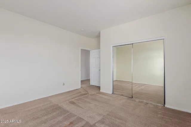 a view of empty room with windows