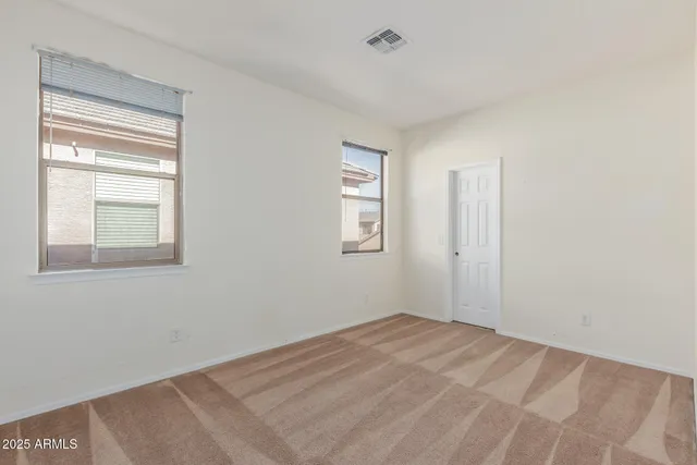 a view of room with window and hardwood floor