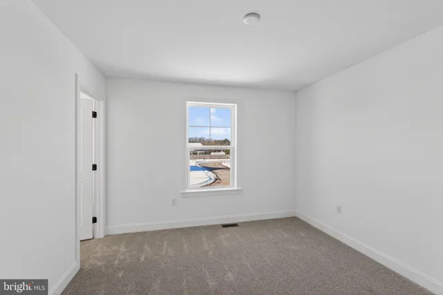 a bathroom with 2 sink toilet and a mirror