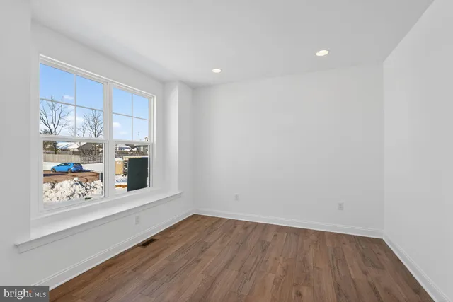a view of wooden floor in a kitchen
