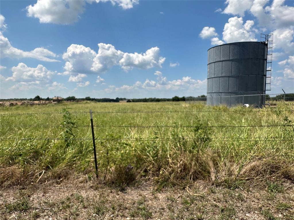 Lot 11 Eastline Road Whitewright, TX 75491 - Photo 2 of 13 a building view with swimming pool and middle in the background
