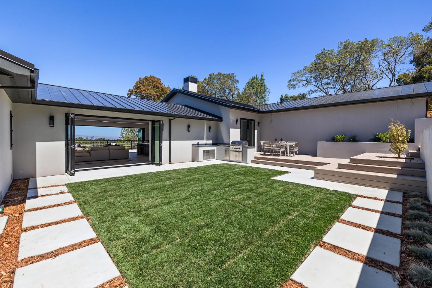 255 Hardwick Road Woodside, CA 94062 - Photo 37 of 90 a view of a house with backyard porch and sitting area