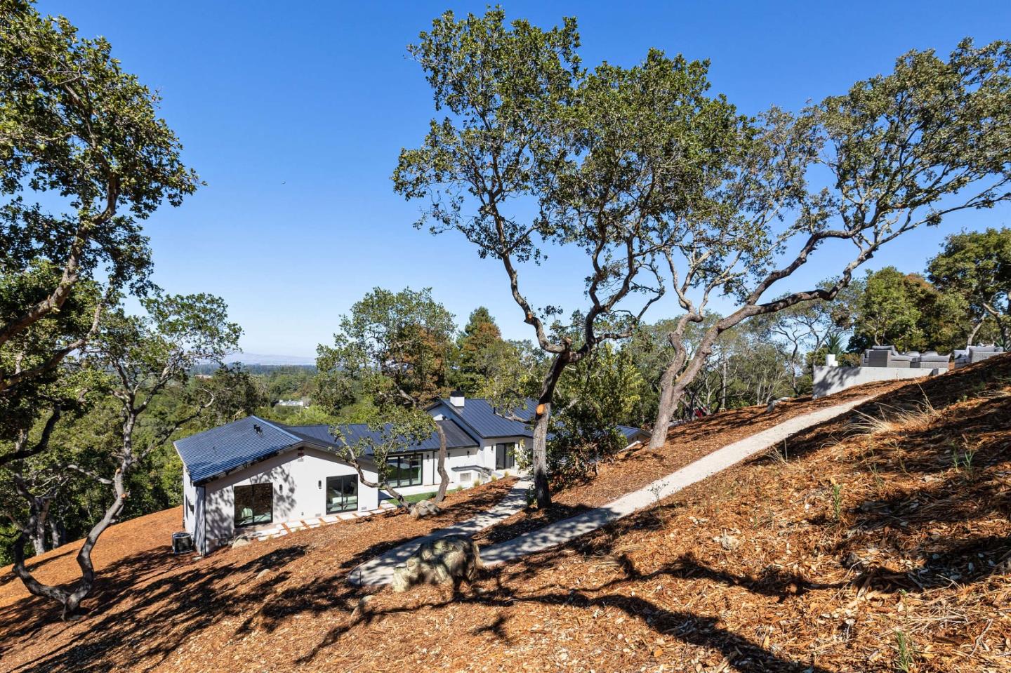 255 Hardwick Road Woodside, CA 94062 - Photo 80 of 90 a front view of a house with a tree
