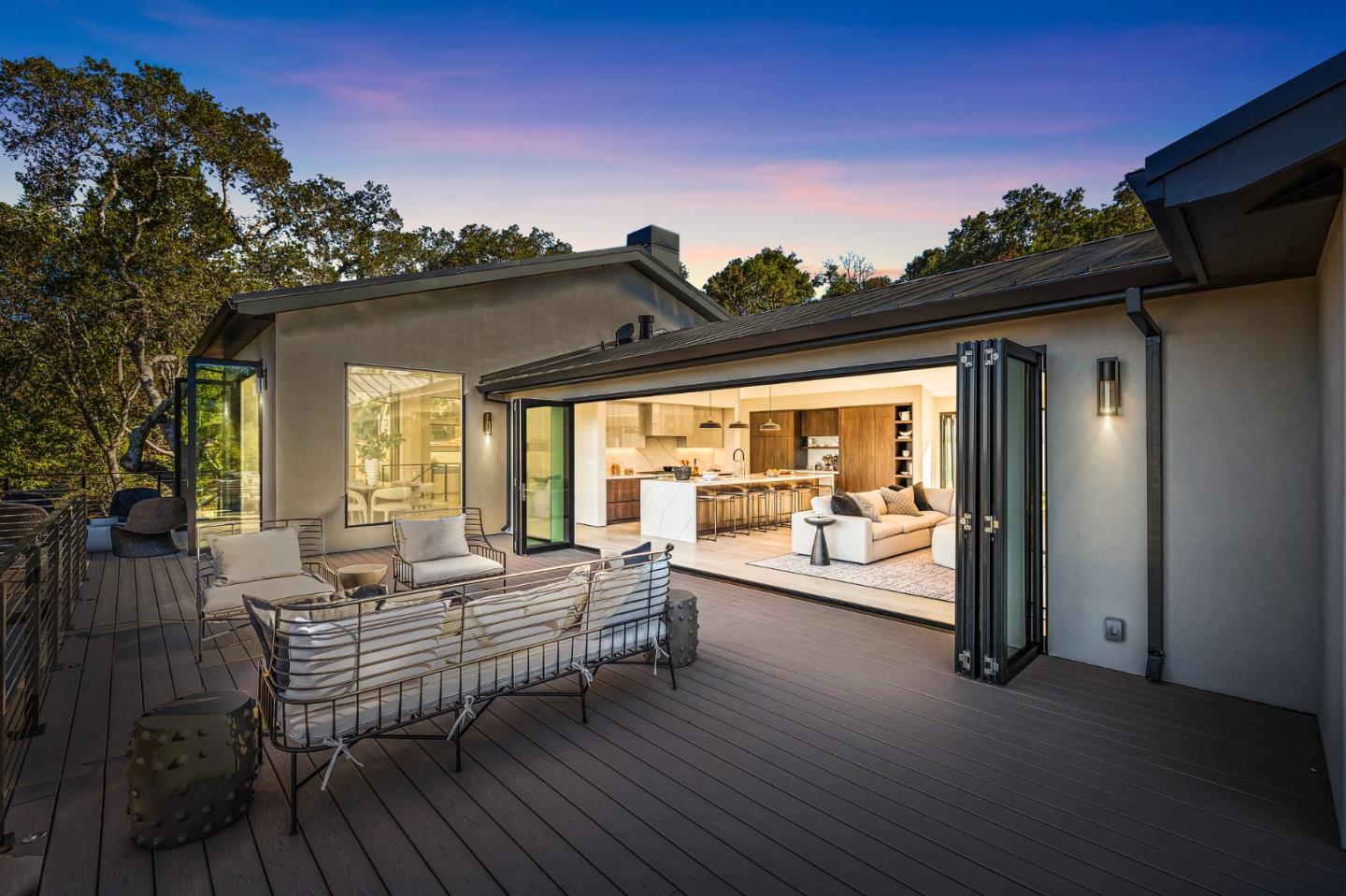 255 Hardwick Road Woodside, CA 94062 - Photo 87 of 90 a view of a patio with table and chairs with wooden floor and fence