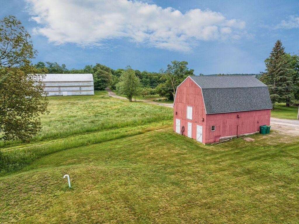 35 Byfield Road Ashburnham, MA 01430 - Photo 3 of 18 a view of a garden with a building in the background