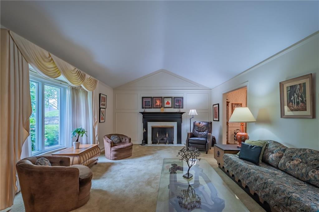704 Pinoak Road Pittsburgh, PA 15243 - Photo 3 of 25 Large living room, with bay window, vaulted ceiling, and gas fireplace...