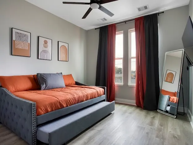 a bedroom with a bed and window