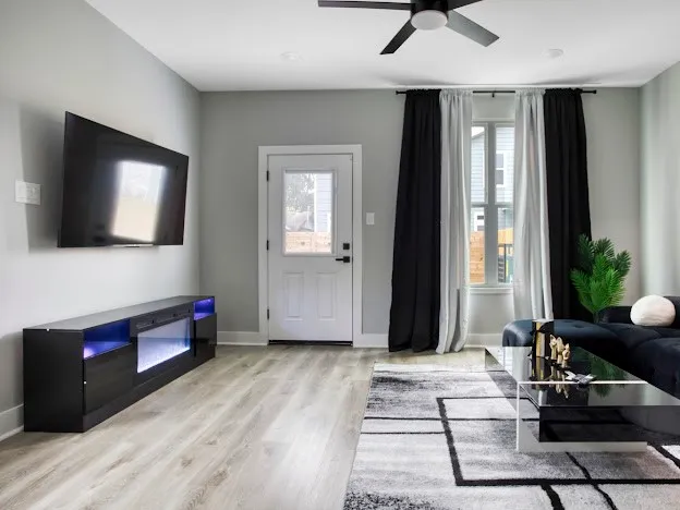 a living room with furniture and a flat screen tv
